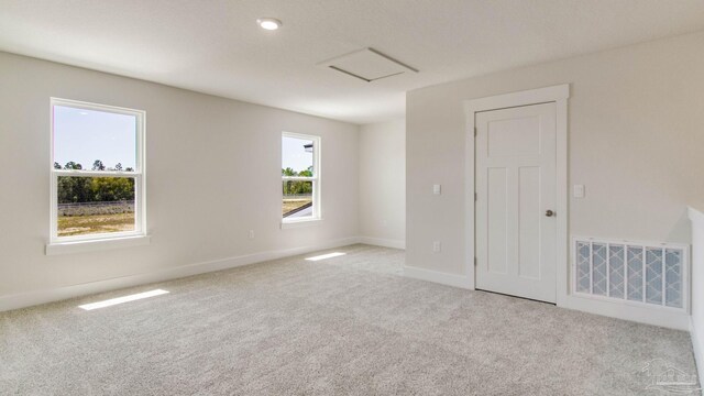 2733 Chevy Cir, Pace, FL 32571 - carpeted spare room with attic access and baseboards