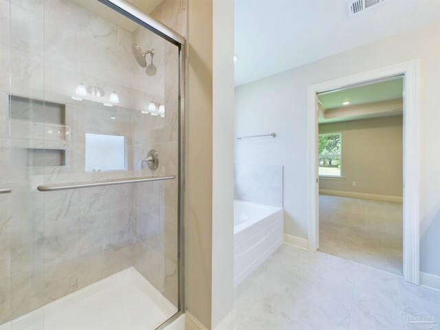 bathroom with tile patterned floors and plus walk in shower