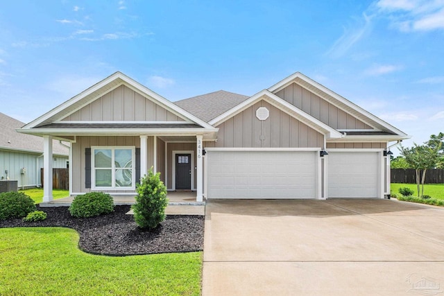 3416 Southwind Dr, Gulf Breeze, FL 32563 - view of front of property with an attached garage, driveway, a porch, and board and batten siding