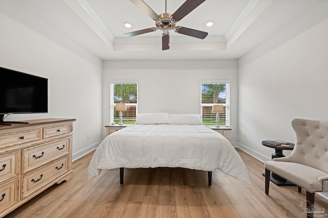 3416 Southwind Dr, Gulf Breeze, FL 32563 - bedroom featuring a tray ceiling, light wood-style flooring, recessed lighting, baseboards, and a ceiling fan