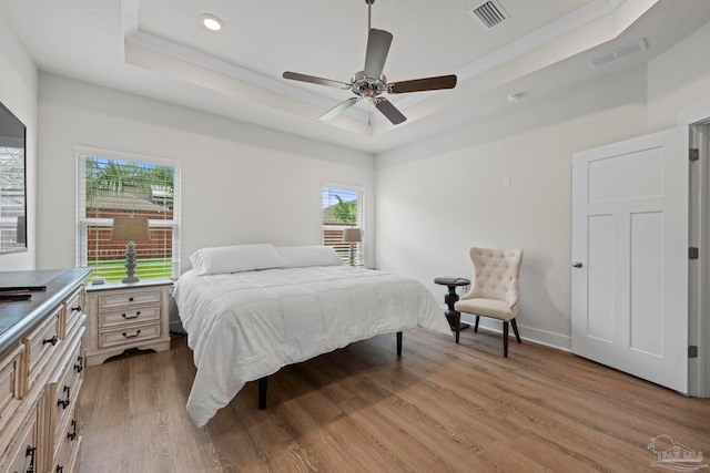 3416 Southwind Dr, Gulf Breeze, FL 32563 - bedroom with a raised ceiling, wood finished floors, recessed lighting, ceiling fan, and baseboards