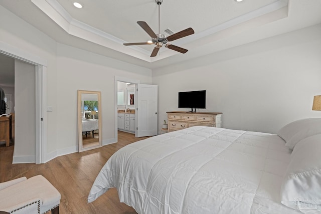 3416 Southwind Dr, Gulf Breeze, FL 32563 - bedroom with a tray ceiling, wood finished floors, recessed lighting, baseboards, and a ceiling fan