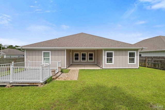 3416 Southwind Dr, Gulf Breeze, FL 32563 - rear view of property with a patio area, board and batten siding, and roof with shingles