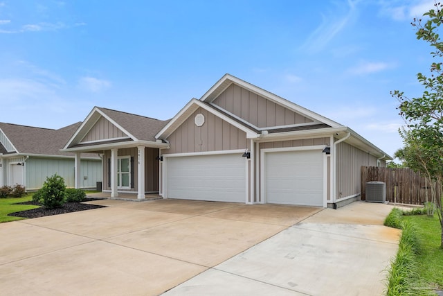 3416 Southwind Dr, Gulf Breeze, FL 32563 - ranch-style house featuring a garage, concrete driveway, central AC unit, a shingled roof, and board and batten siding