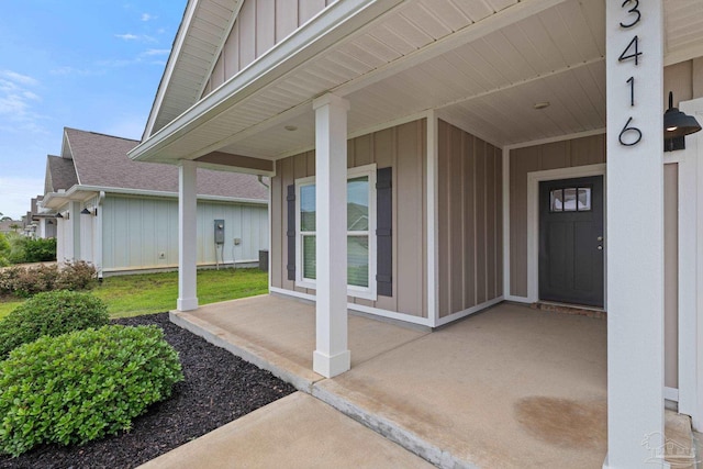 3416 Southwind Dr, Gulf Breeze, FL 32563 - view of exterior entry with board and batten siding and roof with shingles