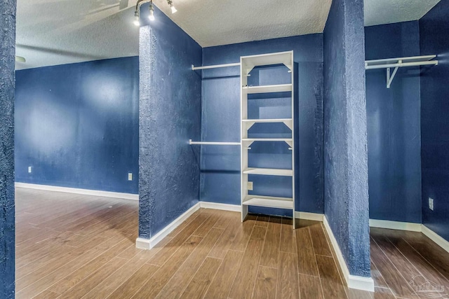 walk in closet featuring hardwood / wood-style floors