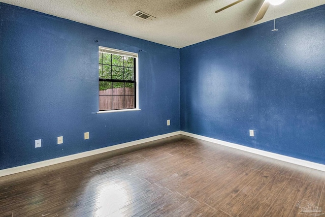 unfurnished room with ceiling fan, wood-type flooring, and a textured ceiling