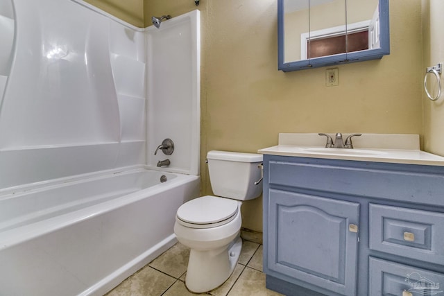 full bathroom with bathing tub / shower combination, toilet, tile patterned floors, and vanity