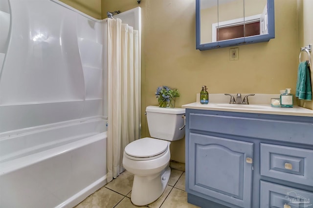 full bathroom with shower / tub combo with curtain, vanity, tile patterned floors, and toilet