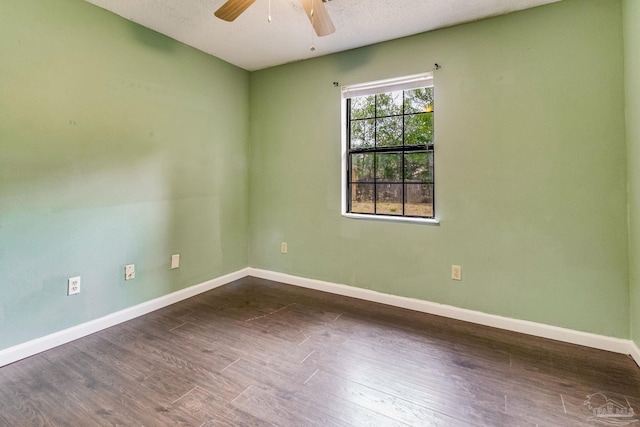 unfurnished room with dark hardwood / wood-style floors, a textured ceiling, and ceiling fan