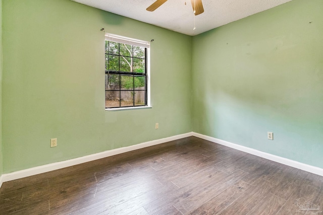 unfurnished room with dark hardwood / wood-style flooring, a textured ceiling, and ceiling fan