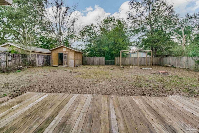 wooden terrace featuring a shed