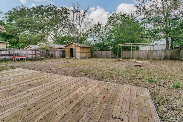 wooden terrace featuring a storage unit