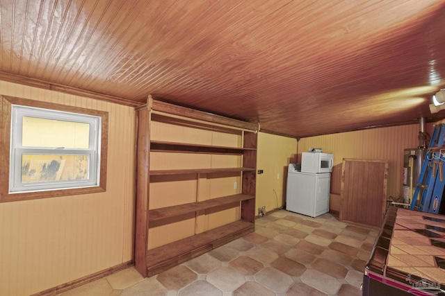 204 Camelia St, Gulf Breeze, FL 32561 - below grade area featuring washer / clothes dryer, wood ceiling, water heater, light flooring, and wooden walls