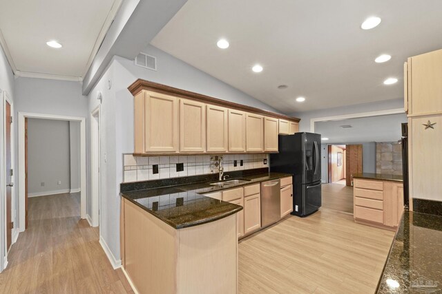 204 Camelia St, Gulf Breeze, FL 32561 - kitchen with dishwasher, a sink, light brown cabinets, black refrigerator with ice dispenser, and backsplash