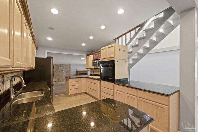 204 Camelia St, Gulf Breeze, FL 32561 - kitchen with oven, light brown cabinetry, a sink, a peninsula, and stainless steel microwave