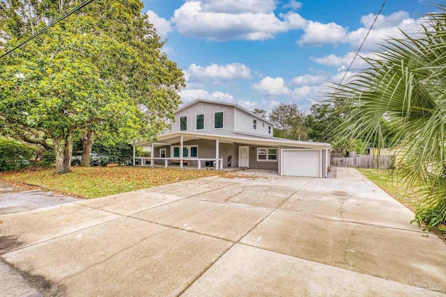 204 Camelia St, Gulf Breeze, FL 32561 - view of front of property with covered porch, concrete driveway, and an attached garage