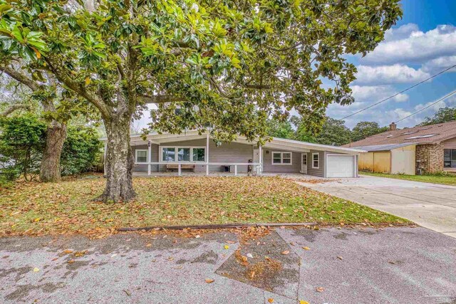 204 Camelia St, Gulf Breeze, FL 32561 - view of front of property with a garage and concrete driveway
