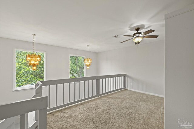 204 Camelia St, Gulf Breeze, FL 32561 - carpeted spare room featuring a chandelier, a ceiling fan, and baseboards