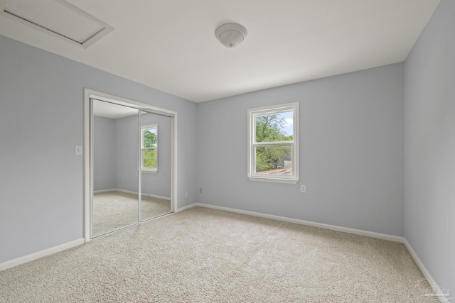 204 Camelia St, Gulf Breeze, FL 32561 - unfurnished bedroom with carpet floors, baseboards, a closet, and attic access
