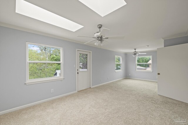 204 Camelia St, Gulf Breeze, FL 32561 - unfurnished room with a skylight, ornamental molding, light carpet, baseboards, and ceiling fan