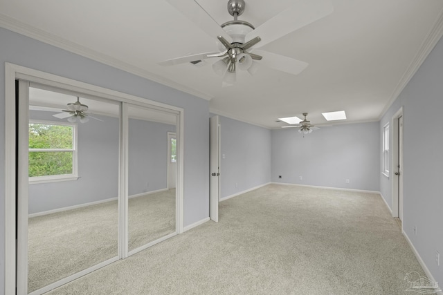 204 Camelia St, Gulf Breeze, FL 32561 - carpeted spare room featuring ornamental molding, ceiling fan, healthy amount of natural light, and a skylight