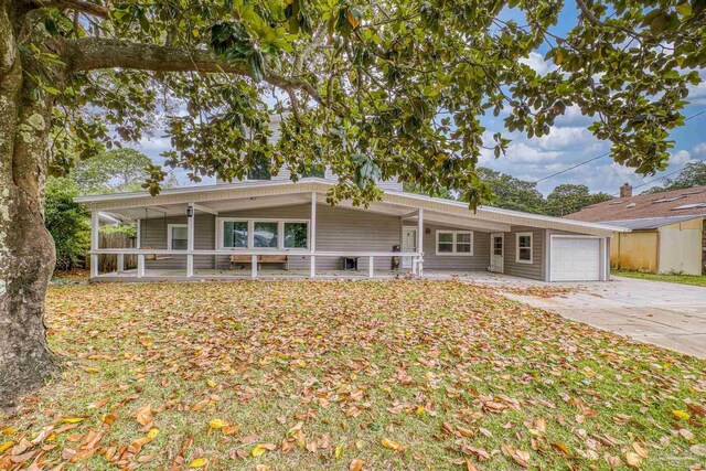 204 Camelia St, Gulf Breeze, FL 32561 - view of front of home with a garage and driveway