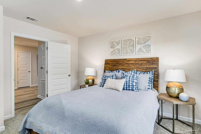 bedroom featuring hardwood / wood-style flooring