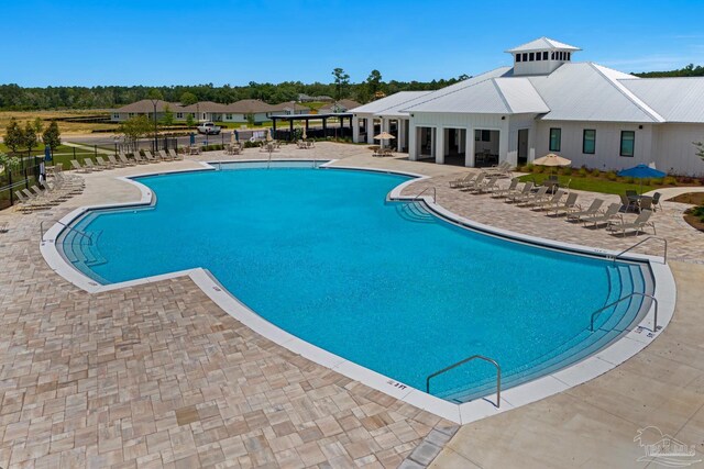 view of pool featuring a patio area