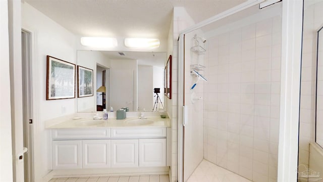 bathroom featuring vanity and an enclosed shower