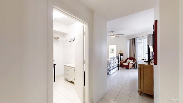 hall with light tile patterned flooring