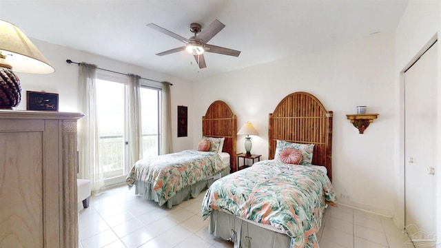 bedroom with light tile patterned floors and ceiling fan