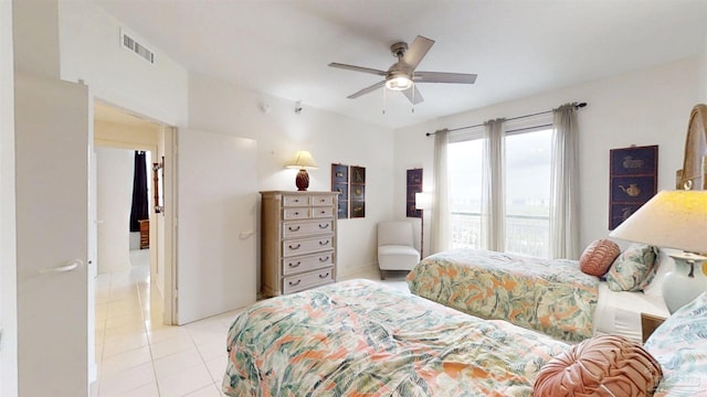 bedroom featuring light tile patterned flooring and ceiling fan