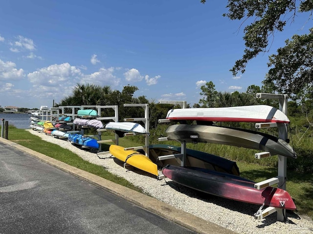 view of parking / parking lot featuring a water view