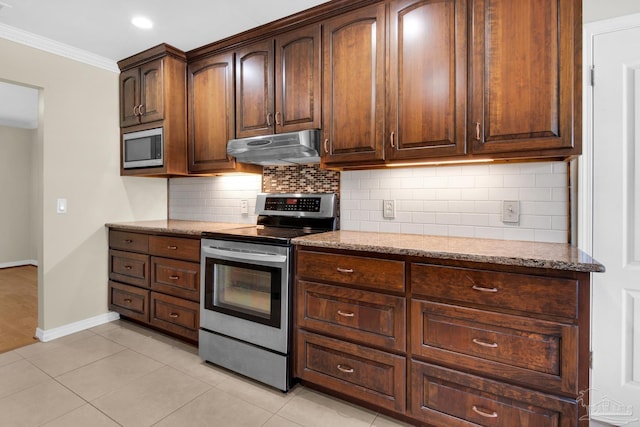 kitchen featuring decorative backsplash, light stone countertops, stainless steel appliances, crown molding, and light tile patterned flooring