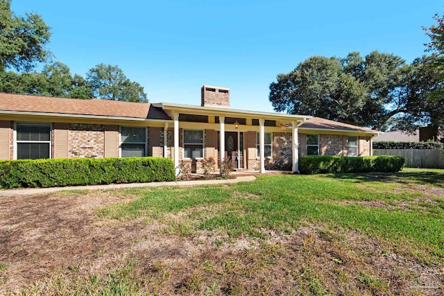 ranch-style home with a front yard