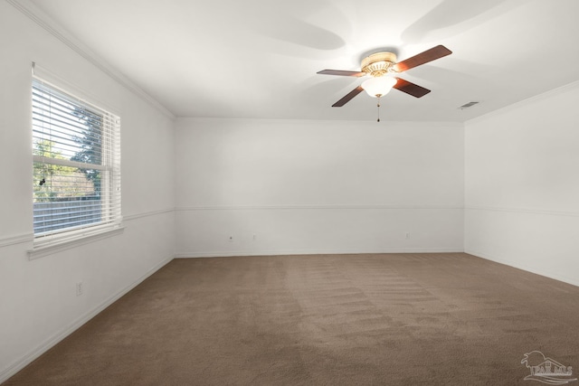 empty room featuring carpet, ceiling fan, and crown molding