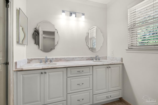 bathroom with vanity and ornamental molding