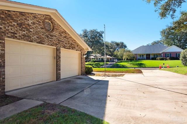 garage with a yard