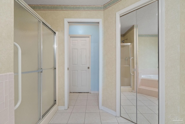 bathroom with crown molding, tile patterned floors, and shower with separate bathtub