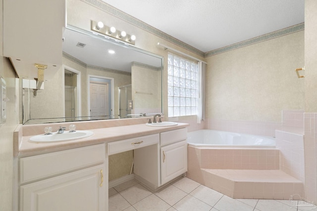 bathroom featuring vanity, separate shower and tub, crown molding, tile patterned floors, and a textured ceiling