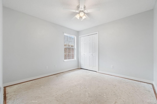 unfurnished bedroom with ceiling fan, a closet, and a textured ceiling