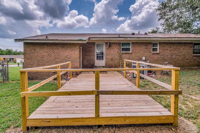 wooden deck with a lawn