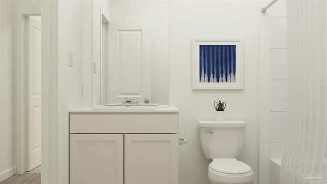 full bathroom featuring vanity, hardwood / wood-style floors,  shower combination, and toilet