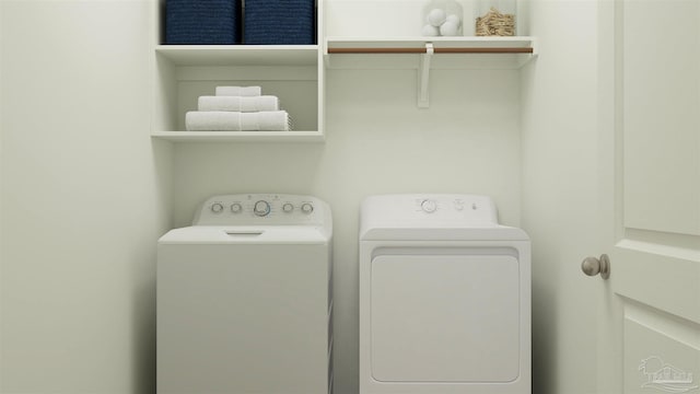 laundry room with washing machine and clothes dryer