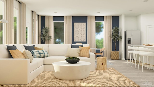 living room with light hardwood / wood-style flooring and plenty of natural light