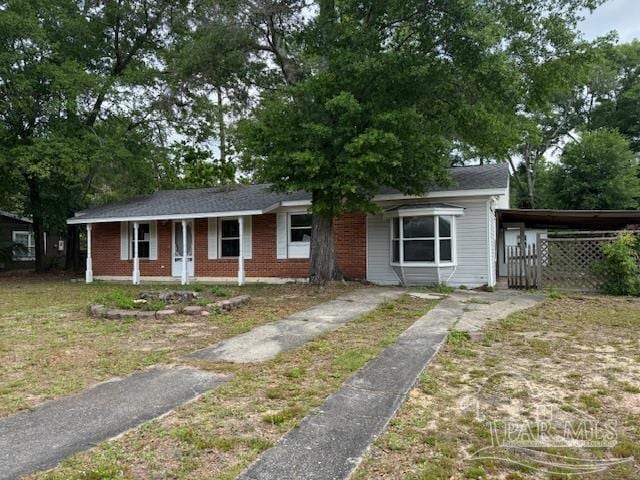 6426 Walnut St, Milton, FL 32570 - ranch-style home with driveway and brick siding