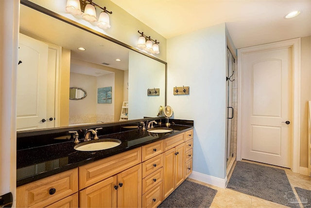 bathroom featuring vanity, walk in shower, and tile patterned floors