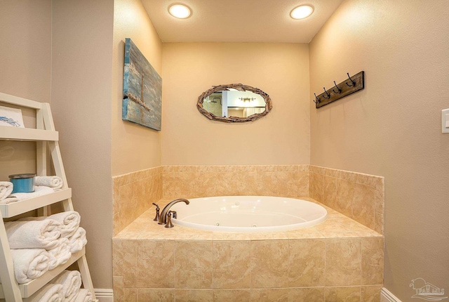 bathroom with a relaxing tiled tub