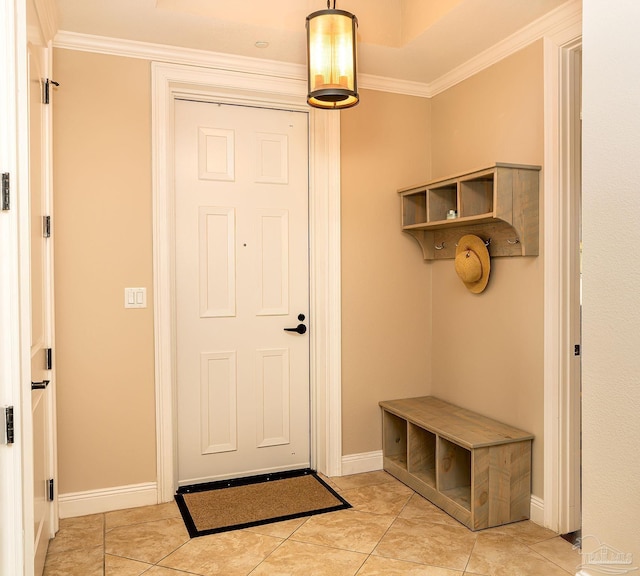 mudroom featuring ornamental molding and light tile patterned floors